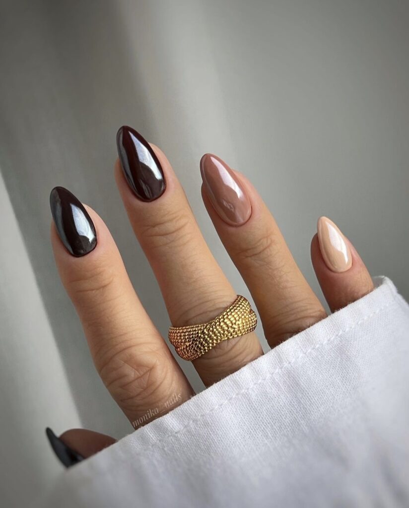 Mix of neutral toned nails in brown, beige, and cream shades.