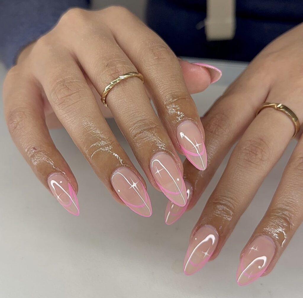 A hand elegantly presents nails with a glossy, transparent base adorned with vibrant neon pink lines along the edges.
