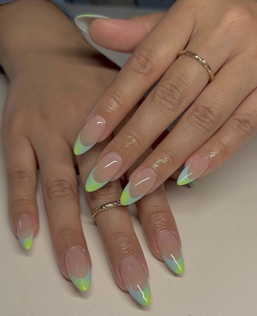 A hand presents a modern twist on French tips, with a vibrant lime green edge.
