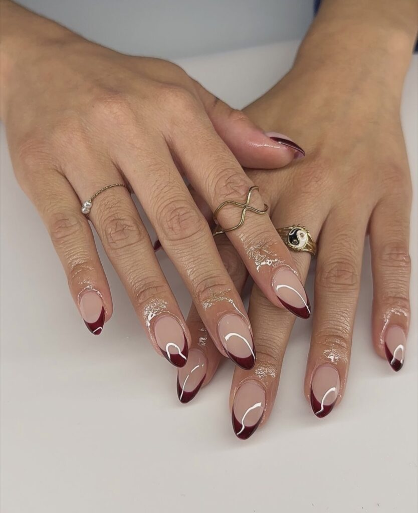 Burgundy French manicure with a deep red tip.