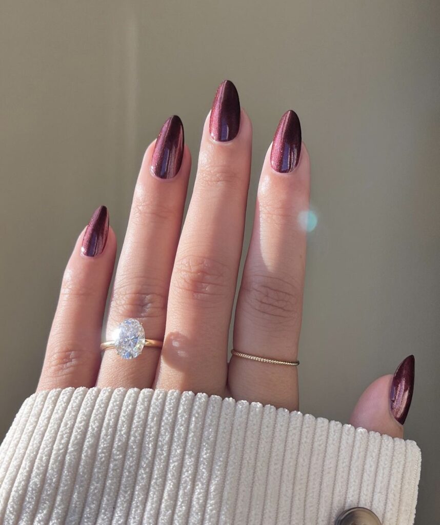 Shiny burgundy metallic nails.