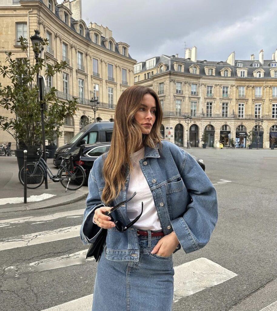 A versatile medium wash denim jacket, paired with a denim skirt. 